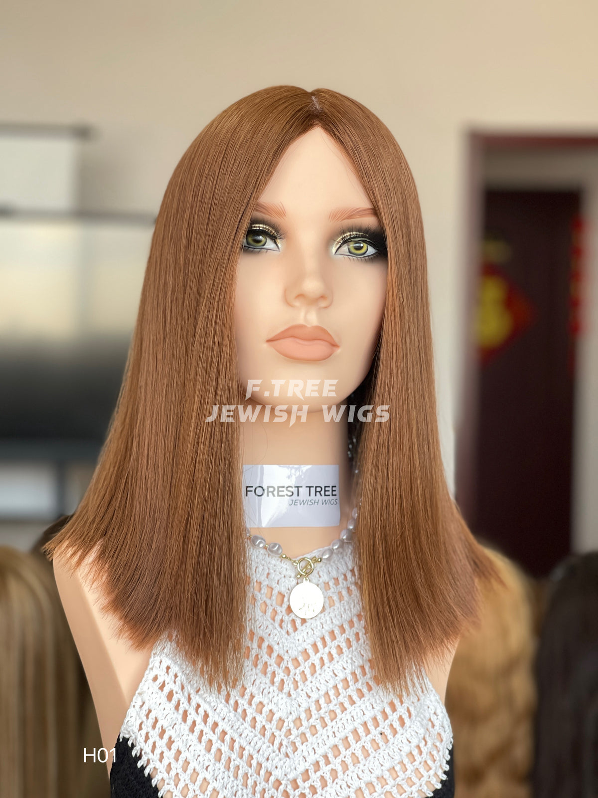 Light copper brown middle-part straight human hair sheitel wig, front view