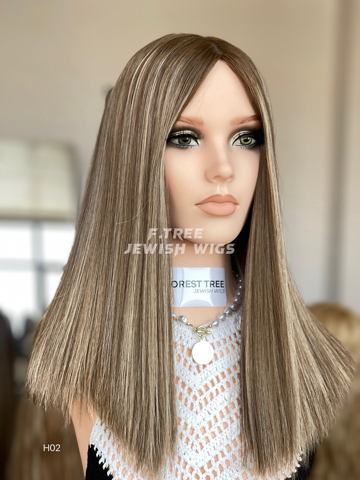 Cool ash blonde middle-part straight human hair sheitel wig, left front view