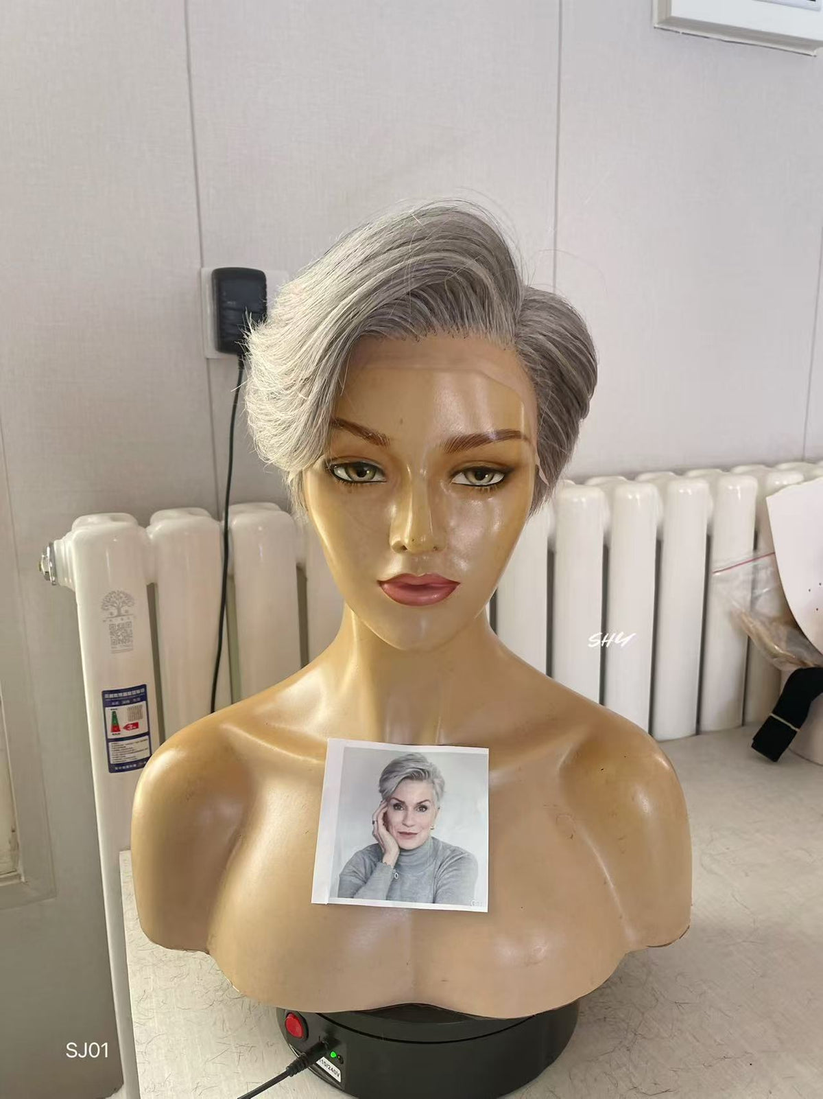 PU Full Lace Silver Gray Salt-and-Pepper Side-Swept Pixie Human Hair Medical Wig front or three-quarter view