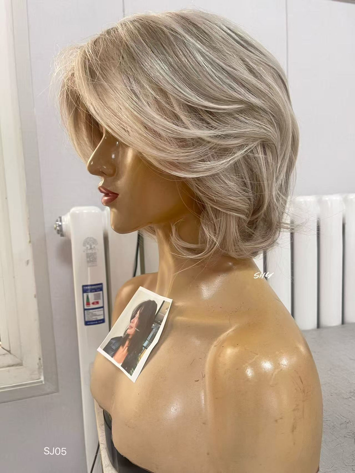 PU Full Lace Ash Blonde Highlighted Voluminous Layered Pixie Bob Human Hair Medical Wig front or three-quarter view