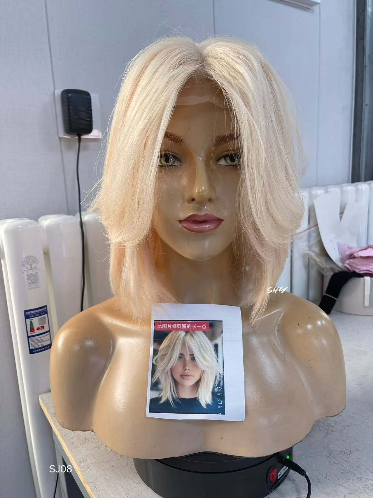 PU Full Lace Icy Platinum Blonde Center-Part Layered Pixie Bob Human Hair Medical Wig front or three-quarter view
